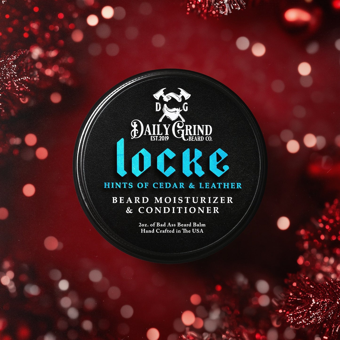 Daily Grind Locke Beard Balm in Cedar and Leather scent, beard conditioner and moisturizer for men shown in a black tin on a red christmas background.