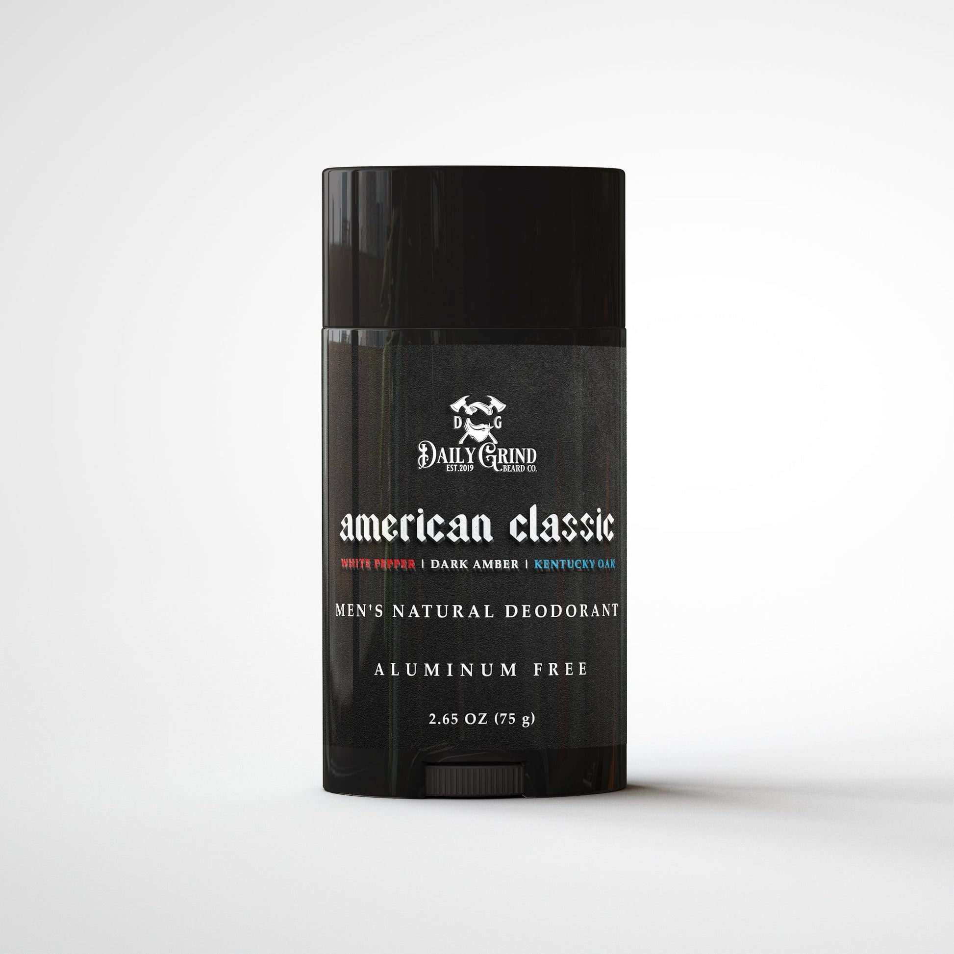 Daily Grind American Classic Deodorant in white pepper, dark amber, and Kentucky oak scent, natural aluminum-free deodorant for men shown in a matte black twist-up stick on a white background