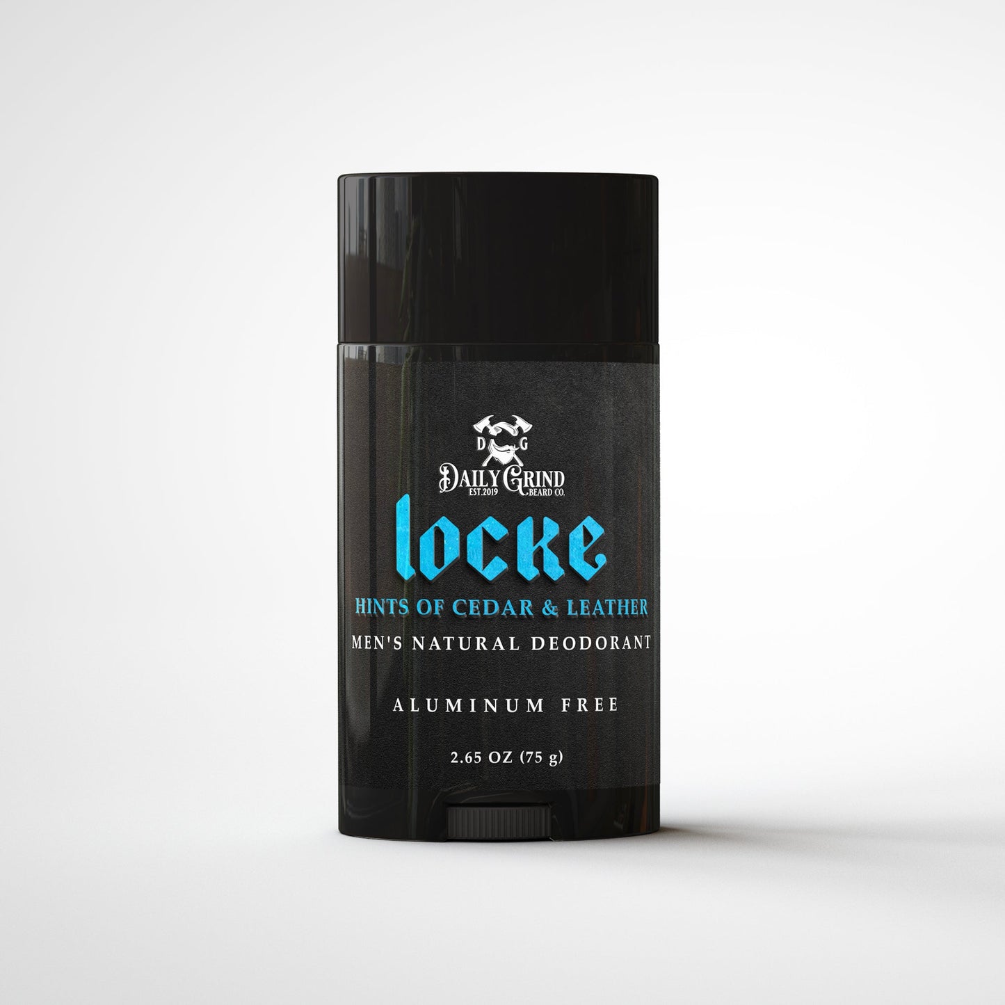 Daily Grind Locke Deodorant in Cedar and Leather scent, natural deodorant for men shown in a matte black twist-up stick on a white grooming surface