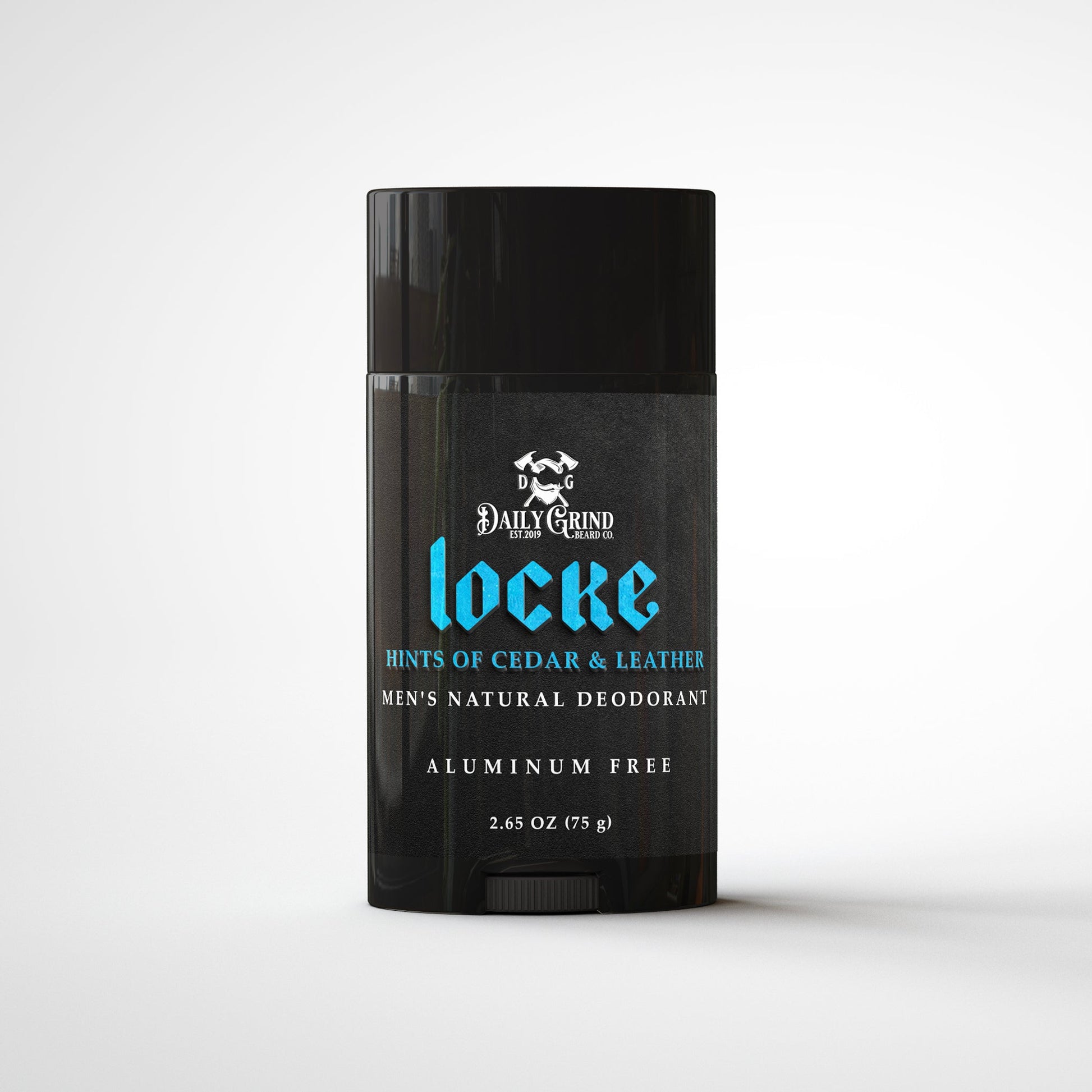 Daily Grind Locke Deodorant in Cedar and Leather scent, natural deodorant for men shown in a matte black twist-up stick on a white grooming surface